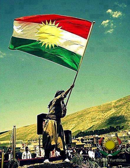 Kurdistan Flag held by a kurd